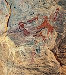 Chad, Terkei West, Ennedi, Sahara.  An ancient Bichrome rock art panel of women with elaborate hairstyles and horses.
