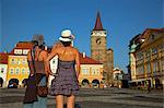 Czech Republic, Bohemia, Hradec Kralove, Jicin. Two young woman standing in the main square.