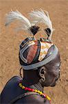 A Dassanech man with a finely decorated clay hairdo, which are a tradition for men of the tribe, Ethiopia