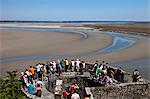 Overview of the  ramparts of Mont Saint Michel and the tidal flats in the English Channel viewed from the mid level steps of Mont Saint Michel, Le Mont Saint Michel, Basse Normandie, France.
