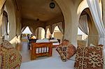 India, Rajasthan, Rohet, Mihir Garh. Open pavilions with airy lounges are a feature of Mihir Garh, or Sun Fort, a luxury hotel built to resemble a medieval Rajput fortress.