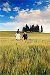 Italy, Tuscany, Siena district, Orcia Valley, Family takes a walk in the countryside near San Quirico dOrcia