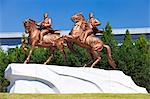 Democratic Peoples Republic of Korea. North Korea, Pyongyang. Statues of Kim Il Sung and Kim Jong Il outside the Mansudae Art Studio.