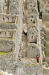 South America, Peru, Cusco, Machu Picchu. A general view of wasi houses at the World Heritage listed Inka Historic Sanctuary of Machu Picchu, situated in the Andes above the Urubamba valley