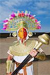 South America, Peru, La Libertad, Trujillo, a model dressed as a Chimu priest with a headdress and a wooden mace at the UNESCO World Heritage listed Chan Chan archaeological site