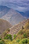 South America, Peru, Cusco, Choquequirao. Threatening clouds over agricultural terraces at the Inca city of Choquequirao built by Tupac Inca Yupanqui and Huayna Capac and situated above the Apurimac valley with mountains of the Salkantay range