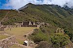 South America, Peru, Cusco, Choquequirao. The plaza principal, main square, and wasi houses at the Inca city of Choquequirao built by Tupac Inca Yupanqui and Huayna Capac and situated above the Apurimac valley with mountains of the Salkantay range
