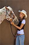 Cowgirl and horse, Apache Spirit Ranch, Tombstone, Arizona, USA