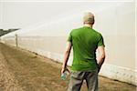 Back View of Mature Man with Water Bottle after Running, Lampertheim, Hesse, Germany