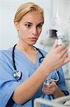 Nurse looking at an intravenous drip