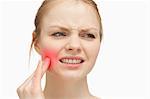 Woman touching highlighted toothache