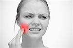 Woman touching red highlighted toothache