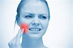 Woman touching highlighted red toothache