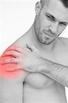 Man touching painful shoulder