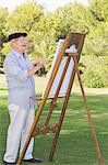 Old man painting outside