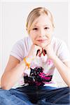 Portrait of Girl Sitting Cross Legged in Studio