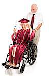 Disabled senior lady graduate gives a thumbs up as her husband pushes the wheelchair.  Full body isolated on white.