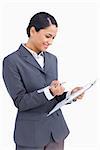 Close up of saleswoman with clipboard and pen against a white background