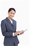 Close up of saleswoman with pen and clipboard against a white background