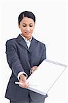 Close up of saleswoman asking for signature against a white background