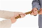 Business people pulling the rope against white background