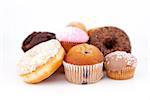 Many cakes laid out together against a white background