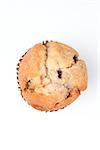 Extreme close up of a muffin against a white background