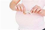 Young woman stop to smoke while she is pregnant against white background