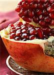 pomegranate ripe fruit  on a silver plate