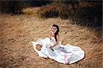 bride on the yellow dry grass