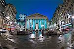 Night view of British financial heart, Bank of England and Royal Exchange. The photo was taken at a slow shutter speed wide-angle fisheye lens
