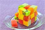 cube fruits salad on lilac background