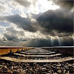 railroad under dramatic sky