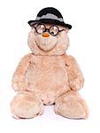 Teddy bear with glasses and hat sitting over white background