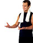 Male trainer posing with open hands and looking away. Studio shot