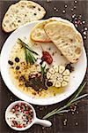Olive oil with balsamic vinegar and spices. Delicious dip and fresh bread ciabatta.