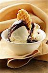 creamy vanilla ice cream with chocolate sauce and waffle