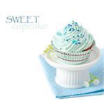 Sweet blue cupcake on a cake stand.