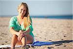 Portrait of Young Woman Sitting on Beach, Palm Beach Gardens, Palm Beach County, Florida, USA