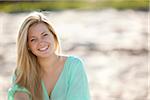 Close-up Portrait of Young Woman on Beach, Looking at Camera and Smiling, Palm Beach Gardens, Palm Beach County, Florida, USA