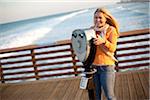 Young Woman Standing on Pier at Beach using Scenic View, Jupiter, Palm Beach County, Florida, USA