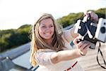 Young Woman on walkway with Camera, Palm Beach Gardens, Palm Beach County, Florida, USA