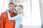 Portrait of Mature Couple Standing under Pier at Beach, Jupiter, Palm Beach County, Florida, USA