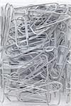 close-up of jumble of silver paperclips