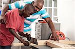 African Father and son working together in a workshop