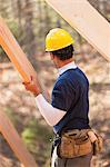 Carpenter placing a rafter