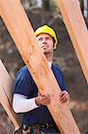 Carpenter placing a rafter