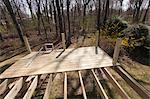 Partially constructed deck with decking cut to fit posts