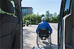 Man with muscular dystrophy and diabetes getting out of an accessible van