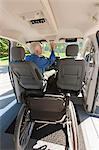 Man with muscular dystrophy and diabetes driving an accessible van